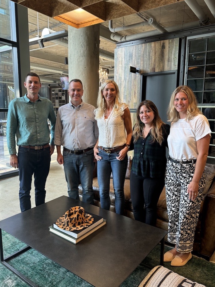 Our Onward Accessibility team posing for a photo in the lobby of our corporate office.